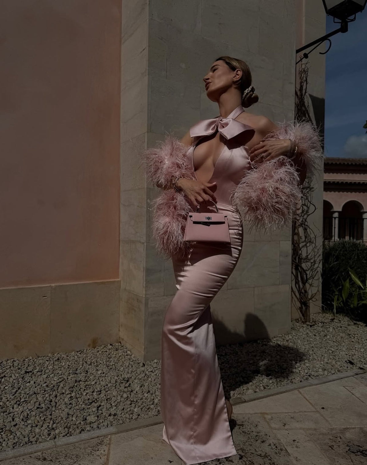 Lena Terlutter - Pink Halter Gown with Bow and Feather Sleeves