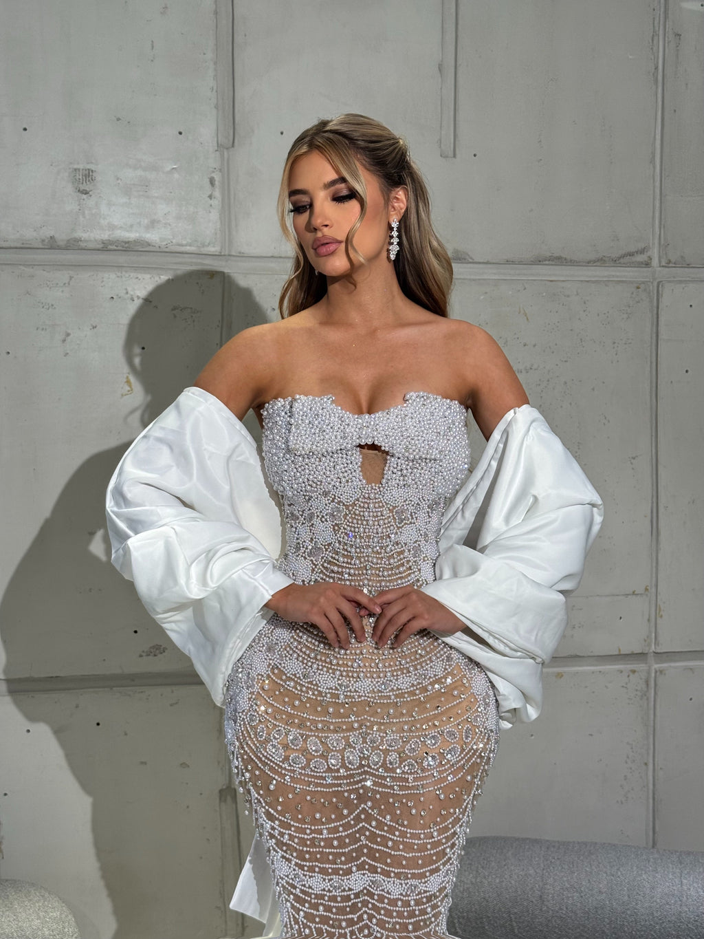 Strapless bridal Gown with pearls and detachable cape sleeve