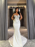 Long dress with crystal embellished bodice and satin mermaid train