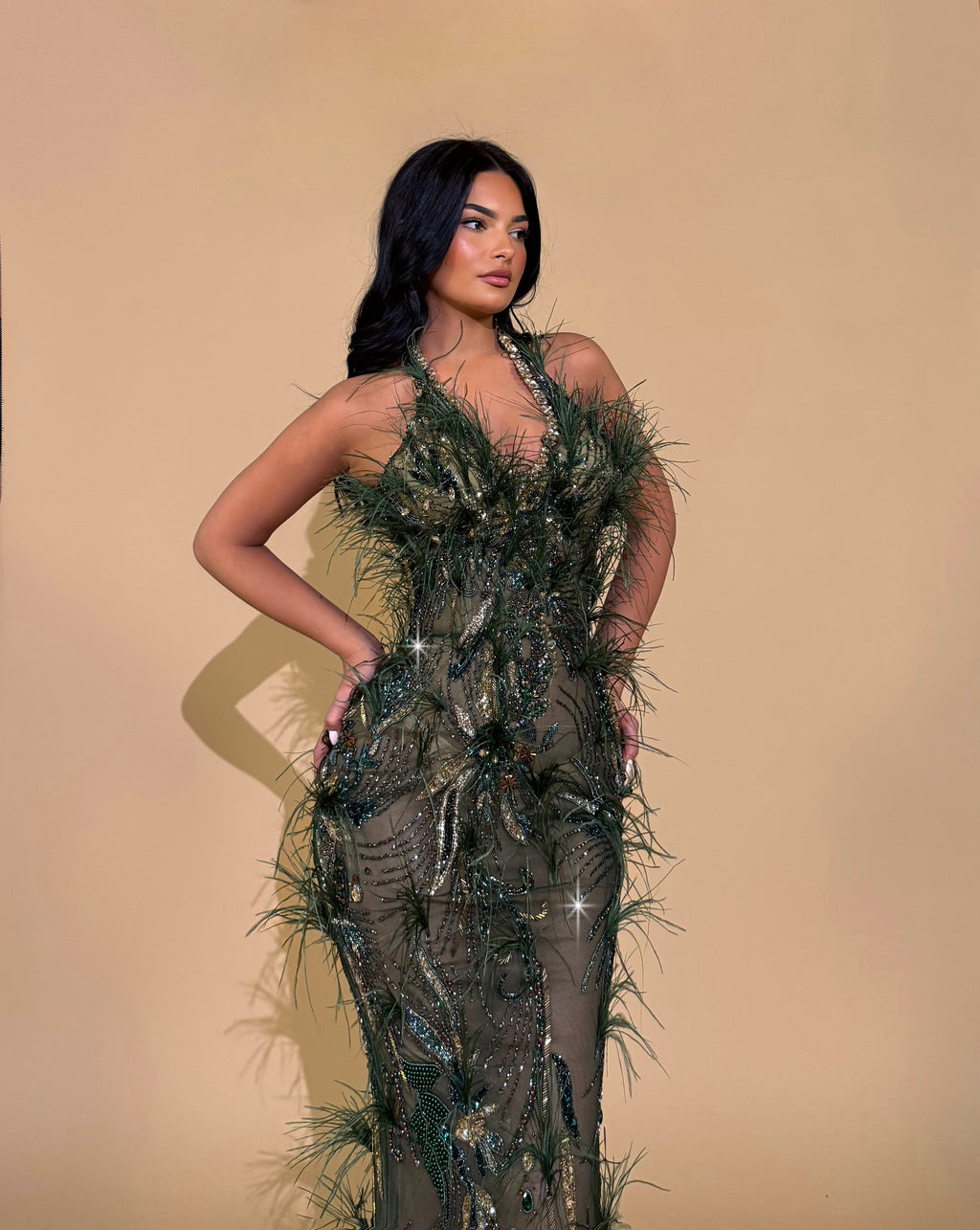 Olive Green Gown with Feather and Sequin Embellishments