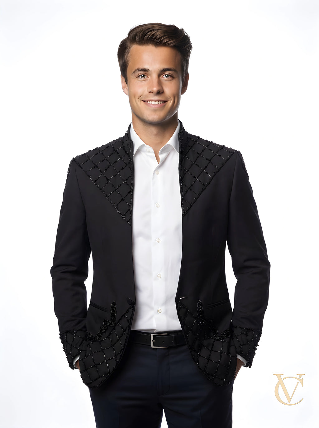 Young man wearing a luxury tailored 2-Piece Suit - Black | Vellure Couture, featuring quilted and beaded detailing on the jacket shoulders and cuffs, paired with a white dress shirt.