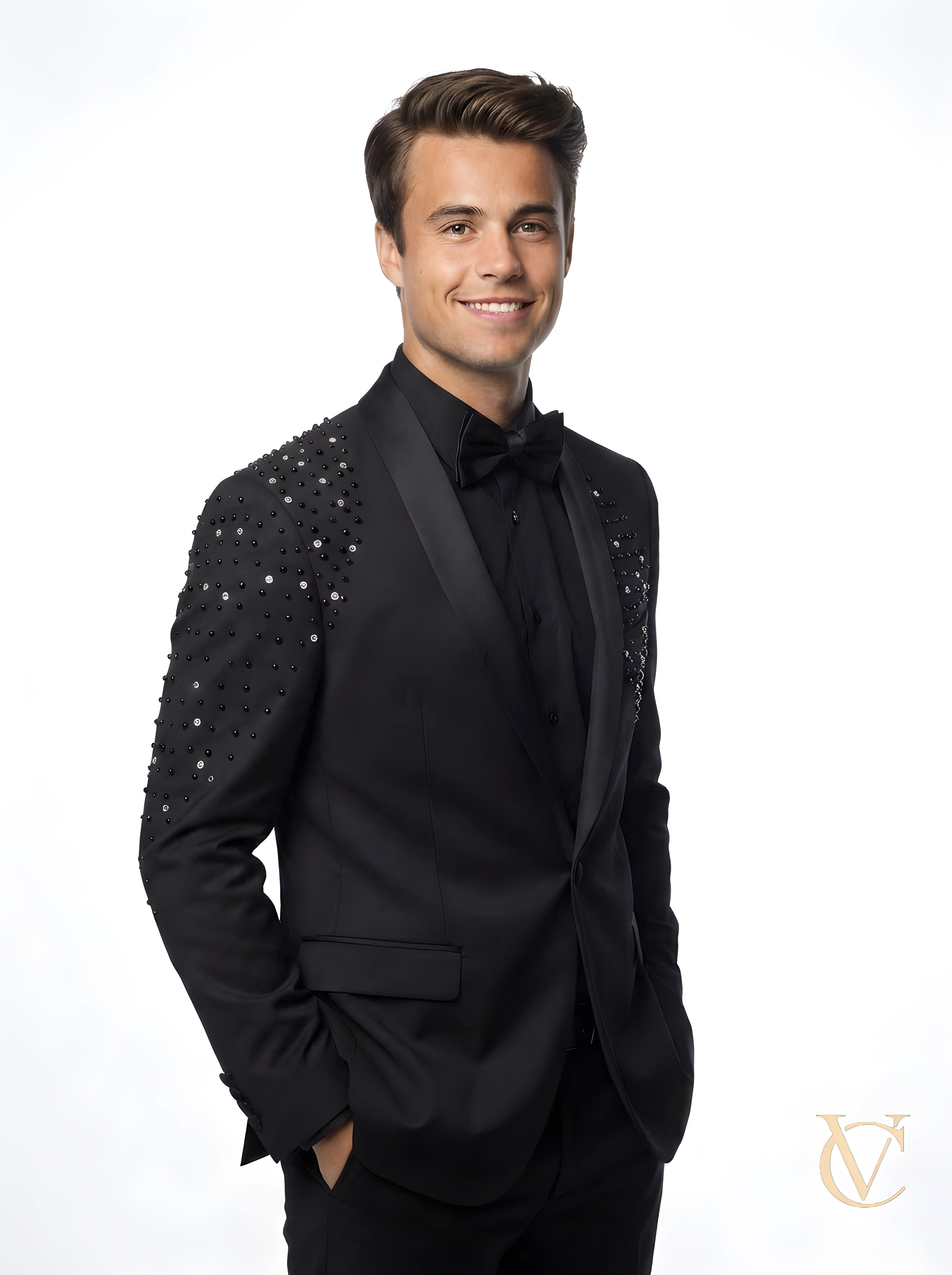 Man wearing a tailored Suit - Black | Vellure Couture with crystal embellished shoulders, black bow tie, and a sculpted fit, styled for luxury fashion UK evening wear.