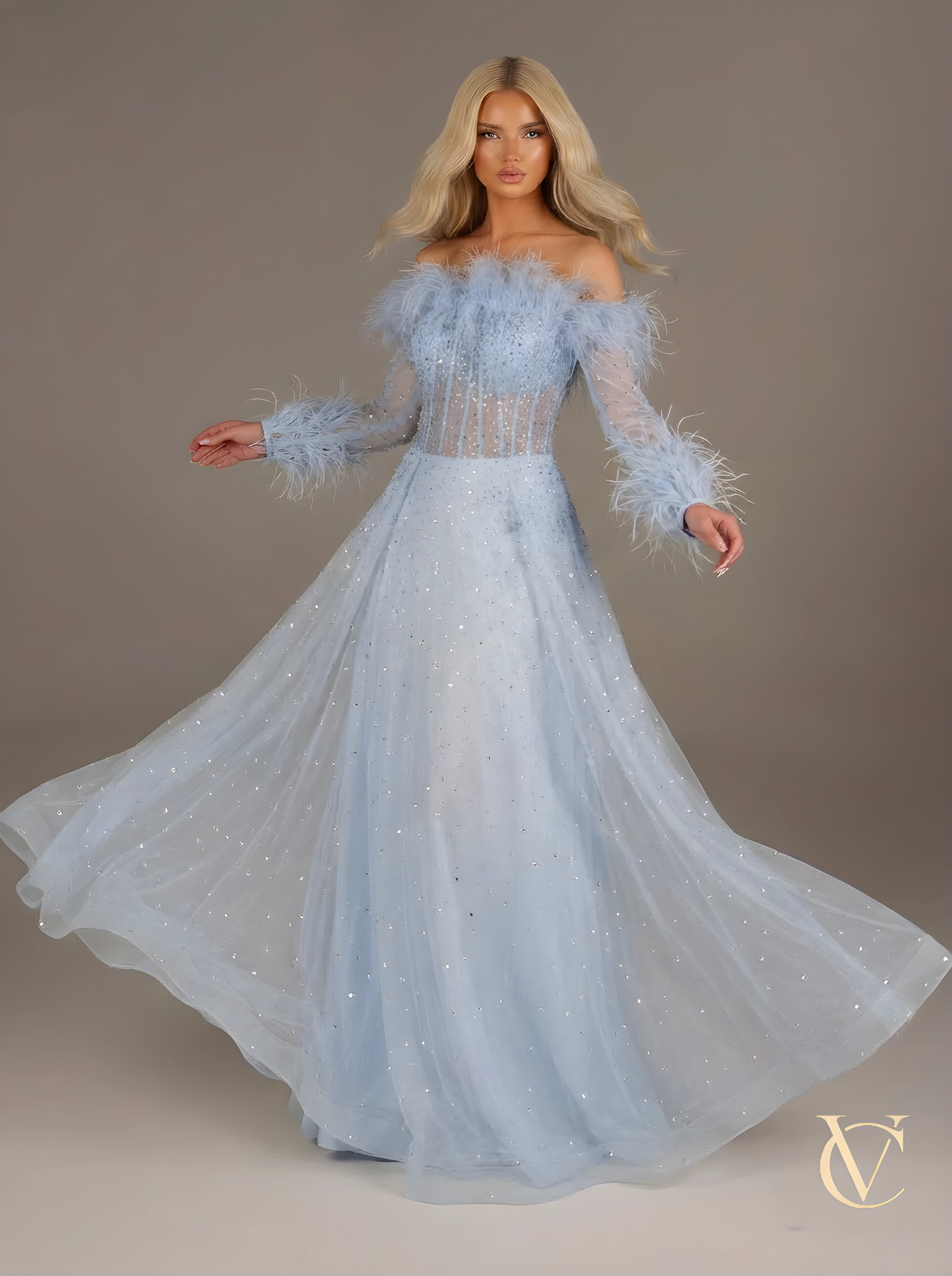 Model wearing Crystal feather Dress - Blue | Vellure Couture, an elegant off-shoulder gown adorned with feathers on the neckline and cuffs, featuring crystal embellishments and a flowing skirt.