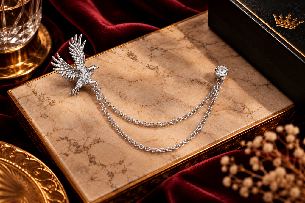 Silver eagle lapel chain on luxury marble background | Vellure Couture®
